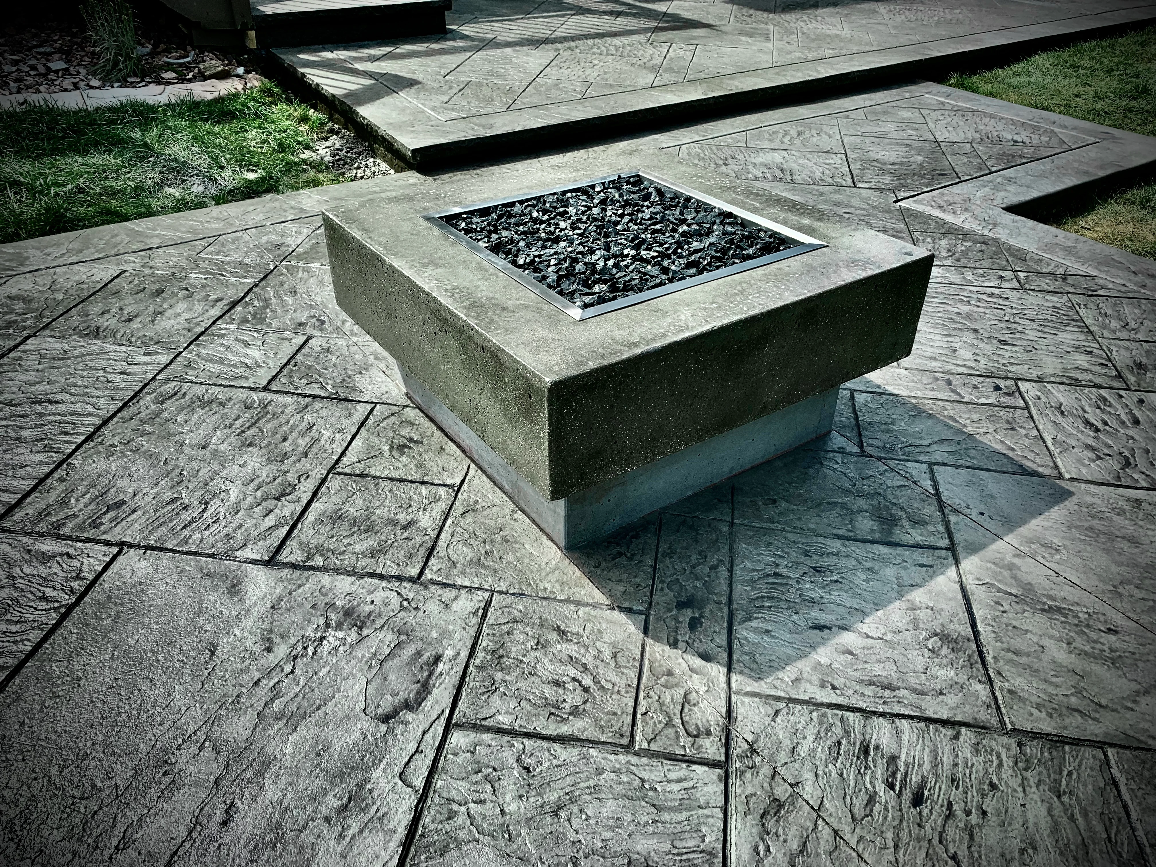 Stamped concrete patio with decorative stone pattern in Northwest Indiana