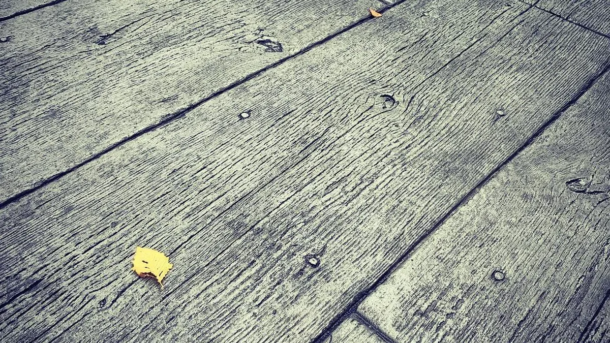 Close-up of a wood-pattern stamped concrete surface