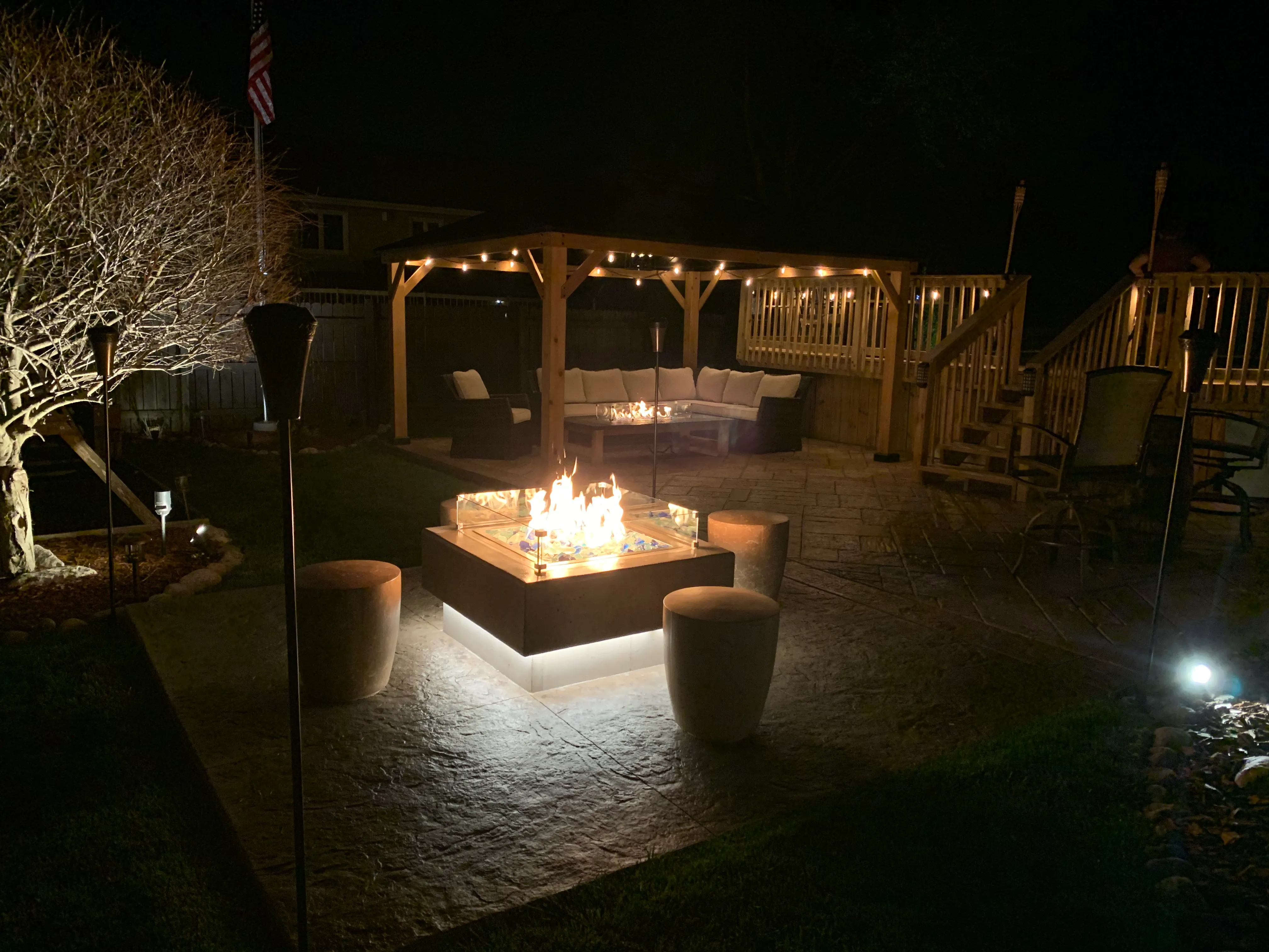 blue glass fire pit nighttime stamped patio munster indiana